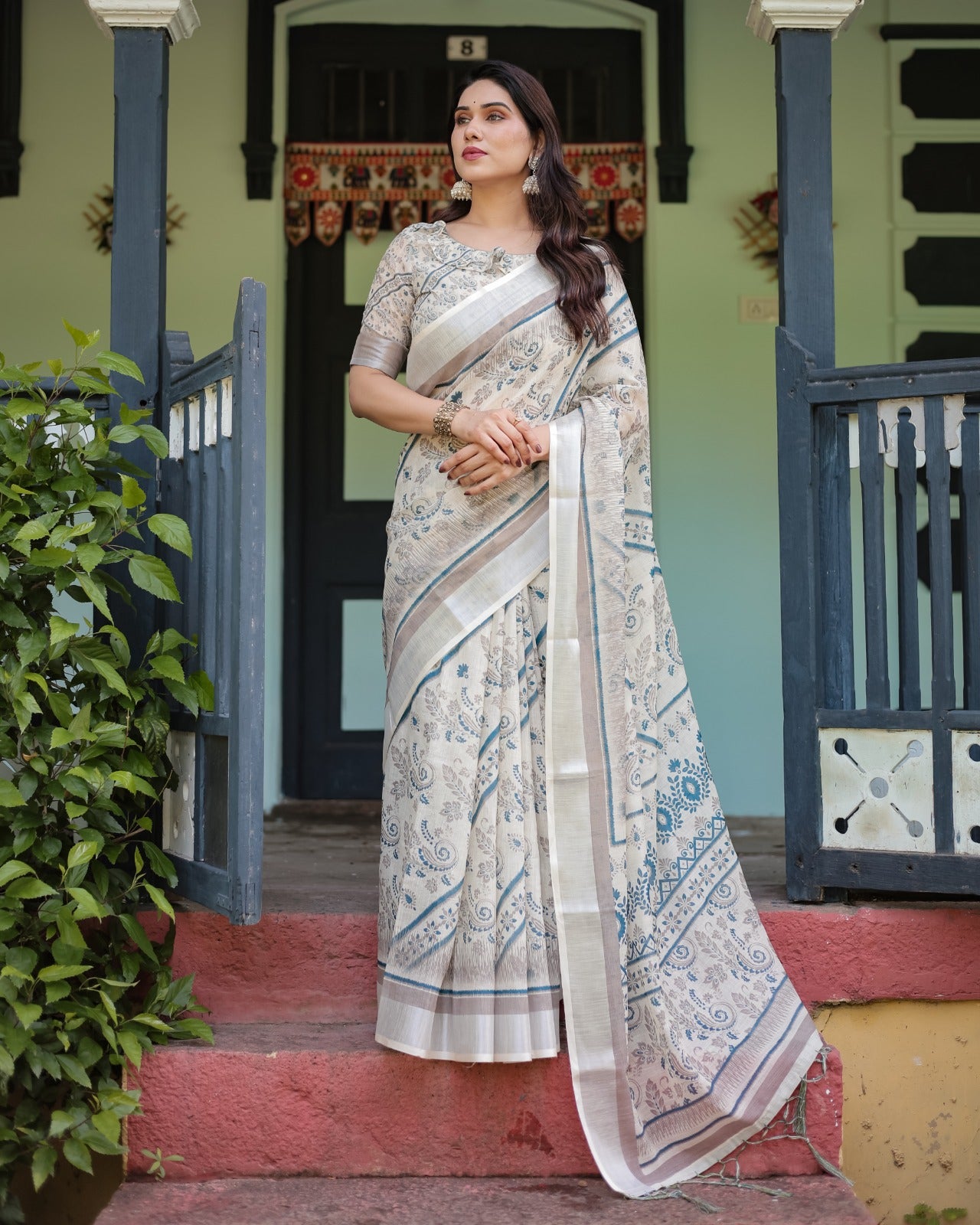 Sophisticated Off-White & Blue Linen Cotton Saree with Paisley Floral Print and Zari Border