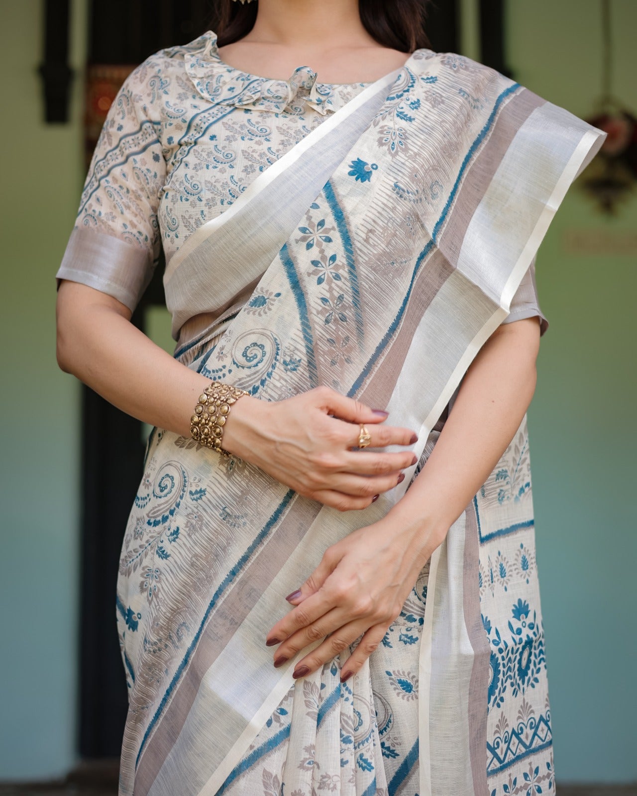 Sophisticated Off-White & Blue Linen Cotton Saree with Paisley Floral Print and Zari Border